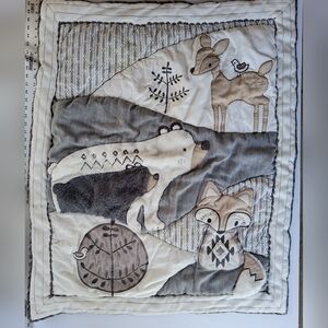 Bailey Levtex baby quilt featuring woodland animals and crib sheet